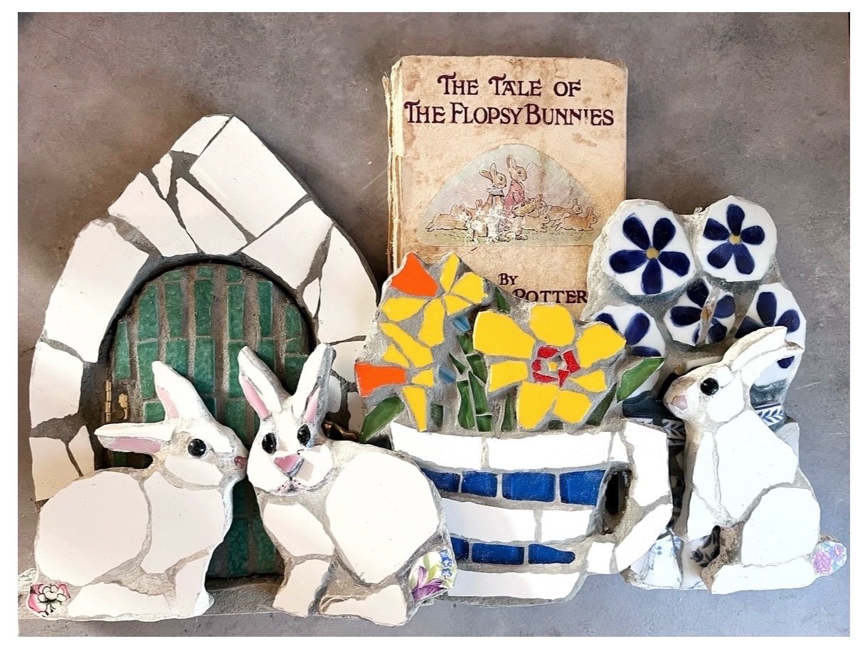 Easter mosaic rabbits and flowers arranged around a vintage Beatrix Potter Flopsy Bunnies book